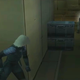 Raiden peeks around a corner while sneaking through the Big Shell.